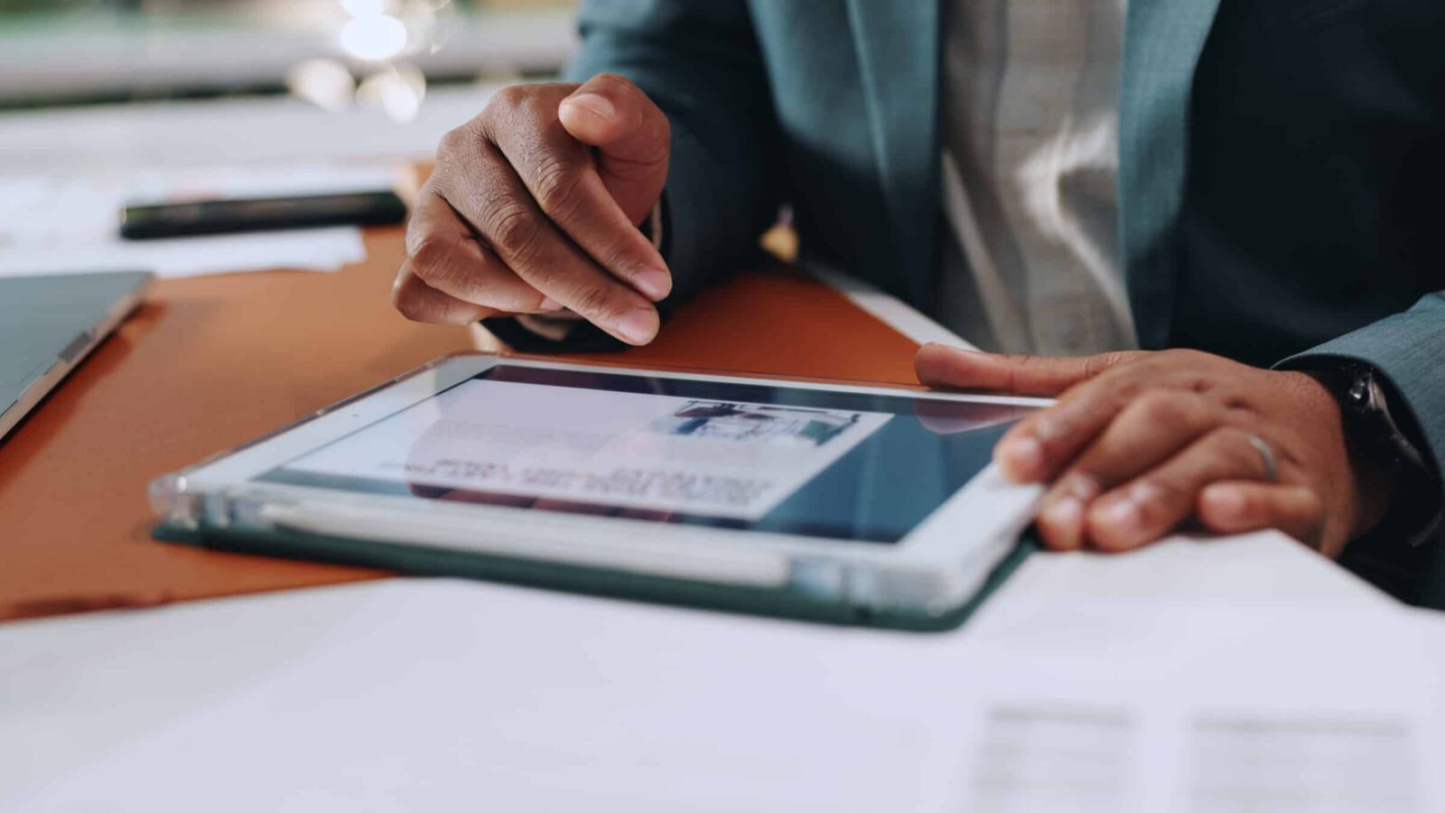 Businessman, hands and tablet with website, article and research for strategy and corporate news in office. Digital tech, project planning and scroll online for reading information, growth with media
